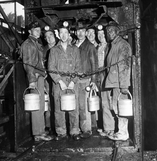 Red Lion, Pennsylvania, USA --- 6/1/1946- Red Lion, PA: Soft coal miners return to work... miners stand in the elevator cage, ready to descend into the H.C. Frick coke company mine at Red Lion, PA., near Connellsville, June 1st, to work their first shift since settlement of the soft coal strike. Pennsylvania'a 75,000 hard coal miners are still on strike while contract negotiations continue. PH: Edwin J. Morgan. --- Image by © Bettmann/CORBIS